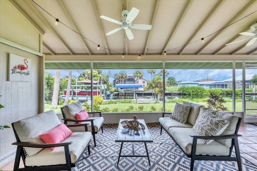 4696 Pompano Street Placida, FL 33946 - Photo 3 of 23 a living room with furniture and a large window