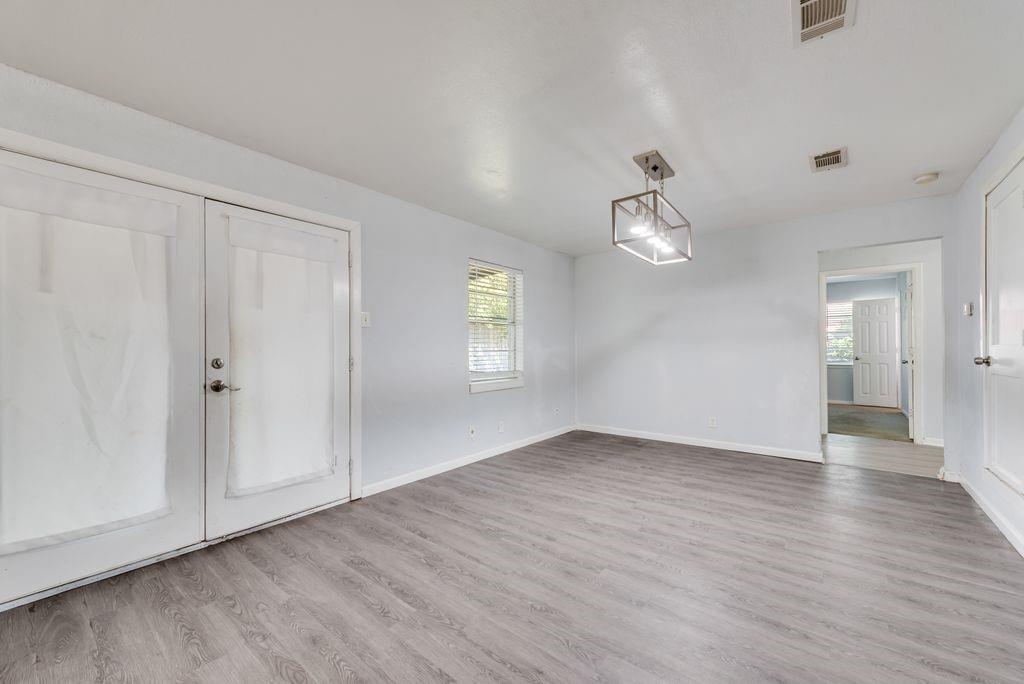 5201 Santa Rosa Drive Haltom City, TX 76117 - Photo 11 of 25 wooden floor in an empty room with a window