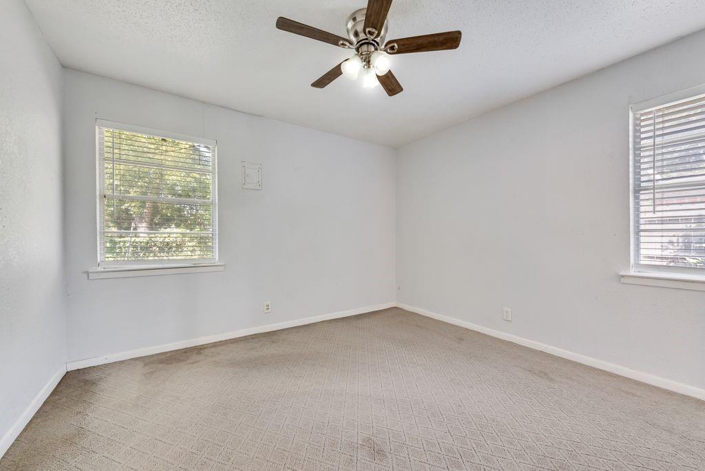 5201 Santa Rosa Drive Haltom City, TX 76117 - Photo 17 of 25 an empty room with a window and a fan