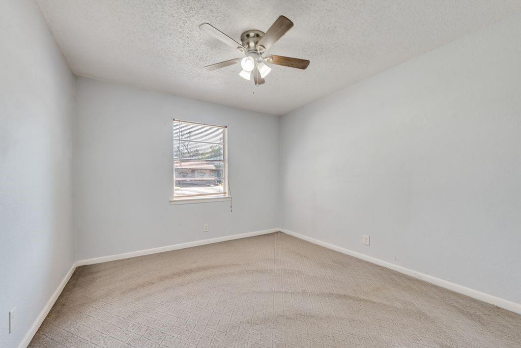 5201 Santa Rosa Drive Haltom City, TX 76117 - Photo 18 of 25 wooden floor in an empty room with a window