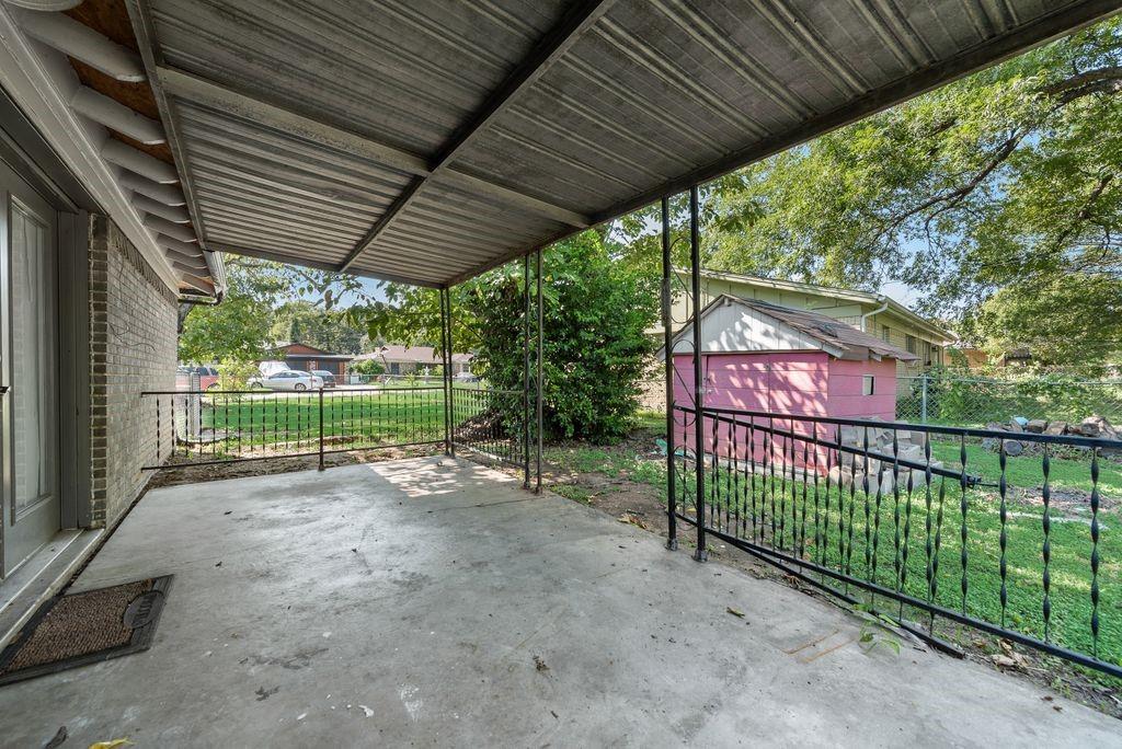 5201 Santa Rosa Drive Haltom City, TX 76117 - Photo 22 of 25 a view of outdoor space with iron fence