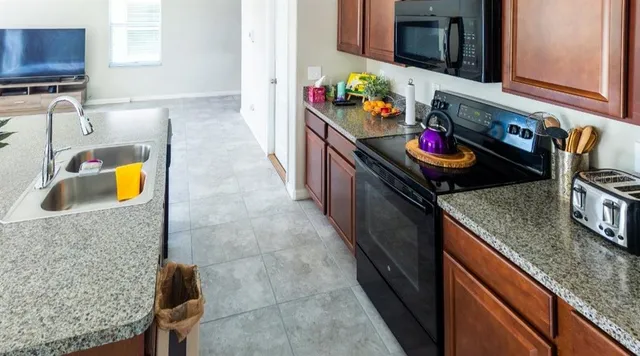a kitchen with granite countertop lots of counter top space