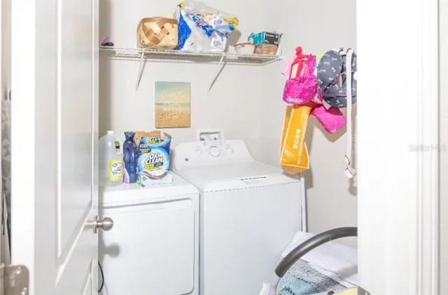 a utility room with dryer and washer