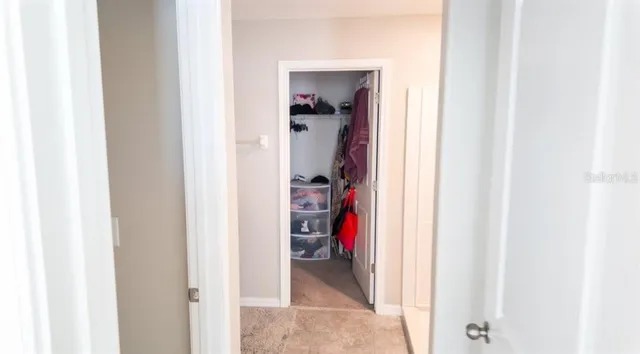 a view of a bedroom from a hallway