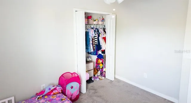 a large white bed in a white room