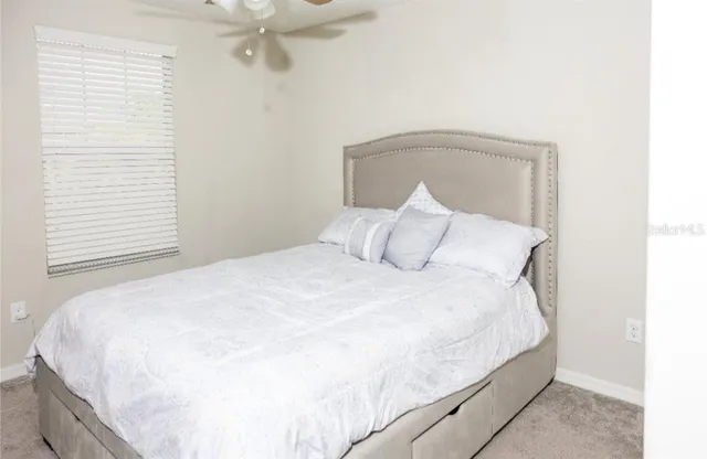 a bedroom with a bed and a closet