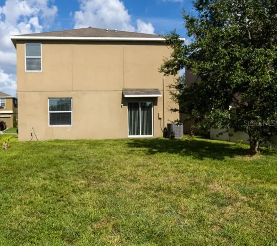 a view of a back yard of the house