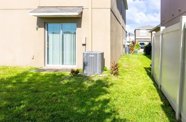 a view of a lake with houses in back