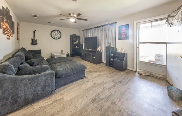 a living room with furniture and a large window
