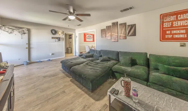 a living room with furniture and a window