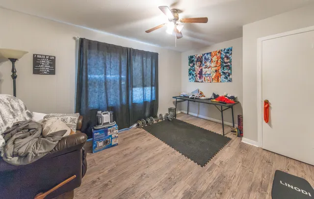 a bed room with a bed mirror and a window