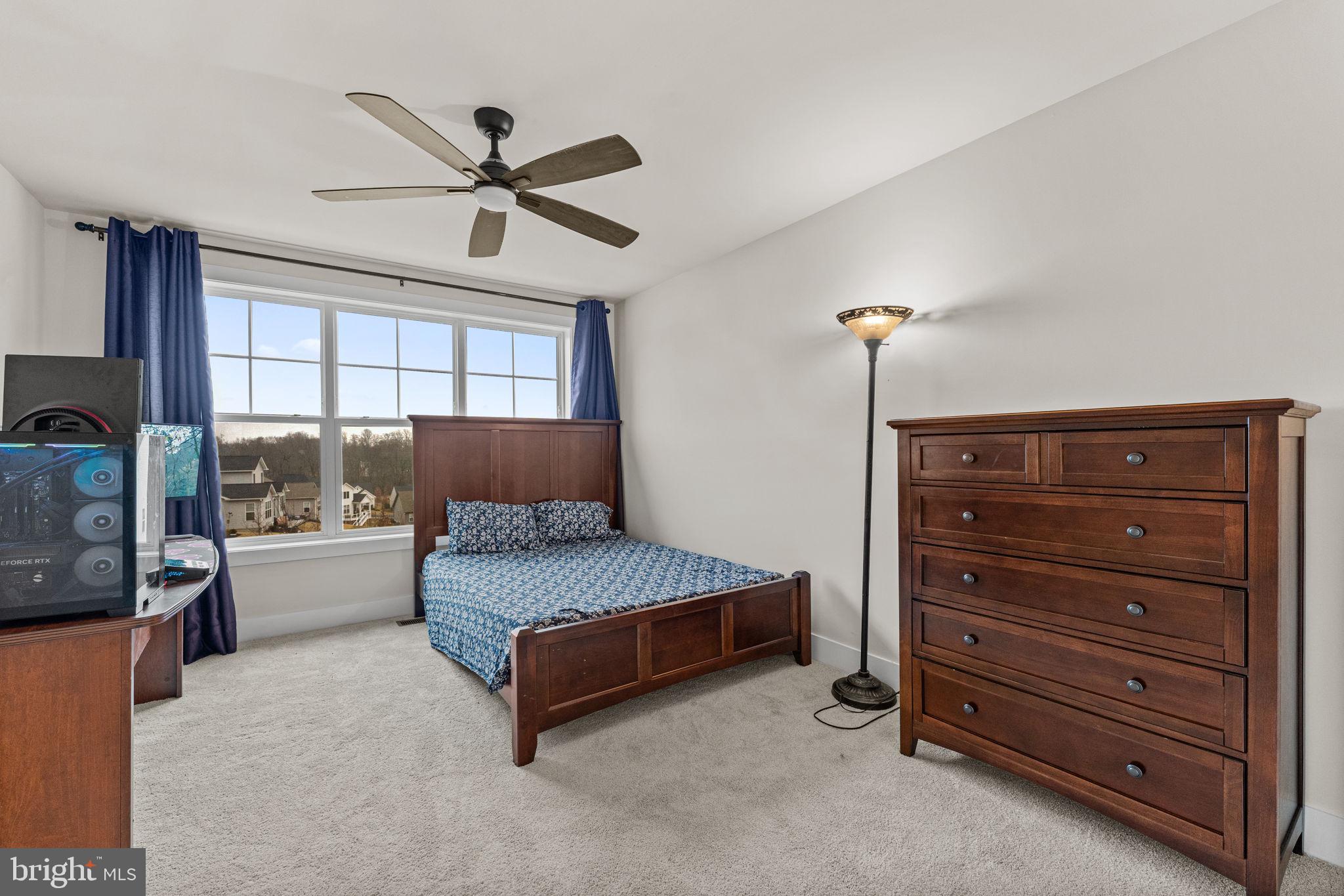 735 Appaloosa Road Downingtown, PA 19335 - Photo 29 of 35 a spacious bedroom with a bed and a window
