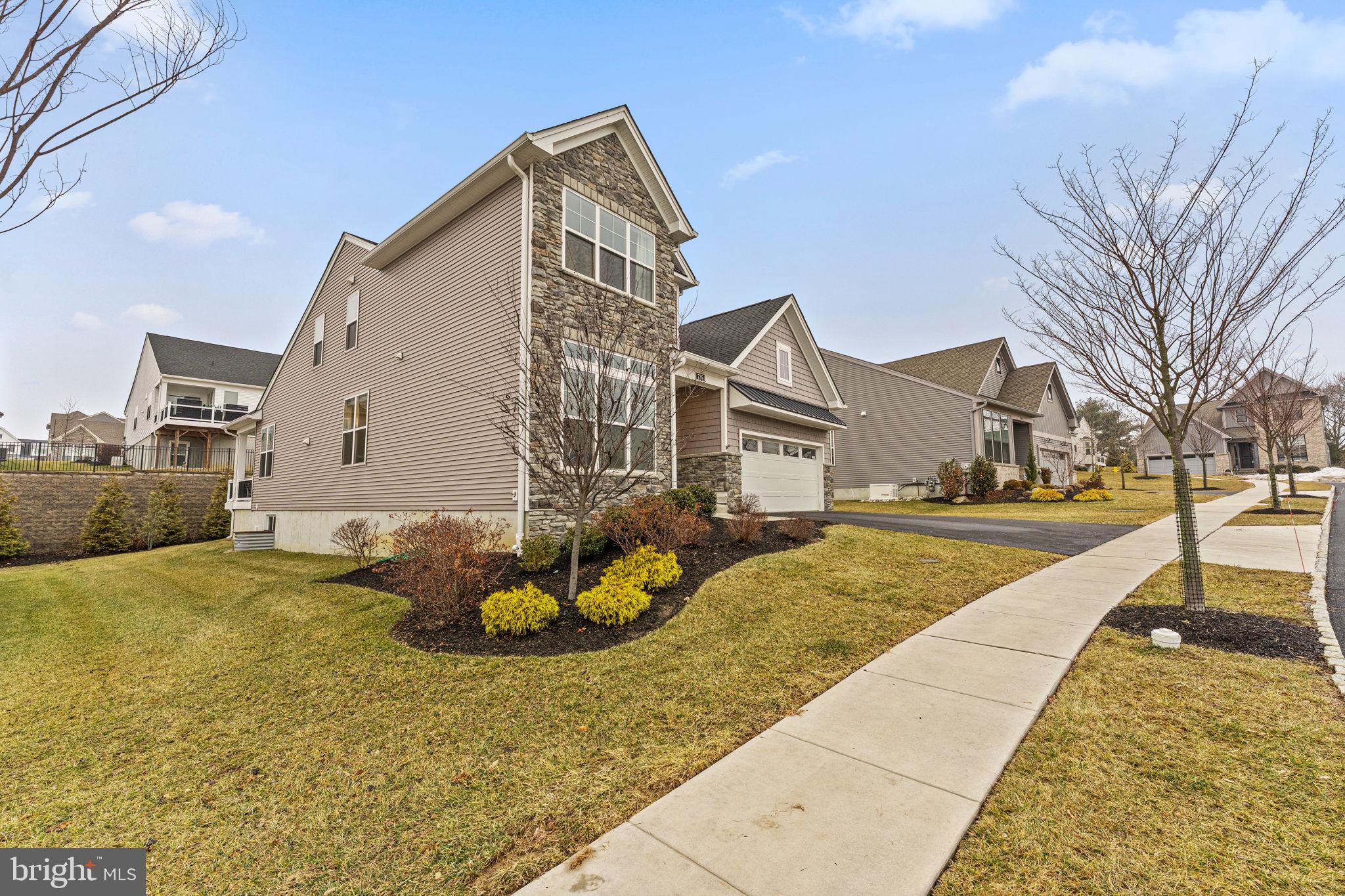 735 Appaloosa Road Downingtown, PA 19335 - Photo 5 of 35 a front view of a house with a yard