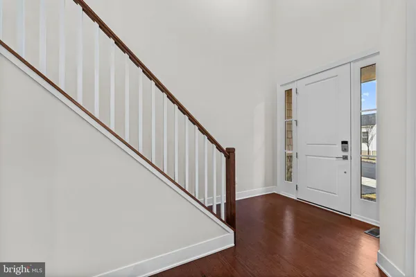 a view of an entryway with wooden floor