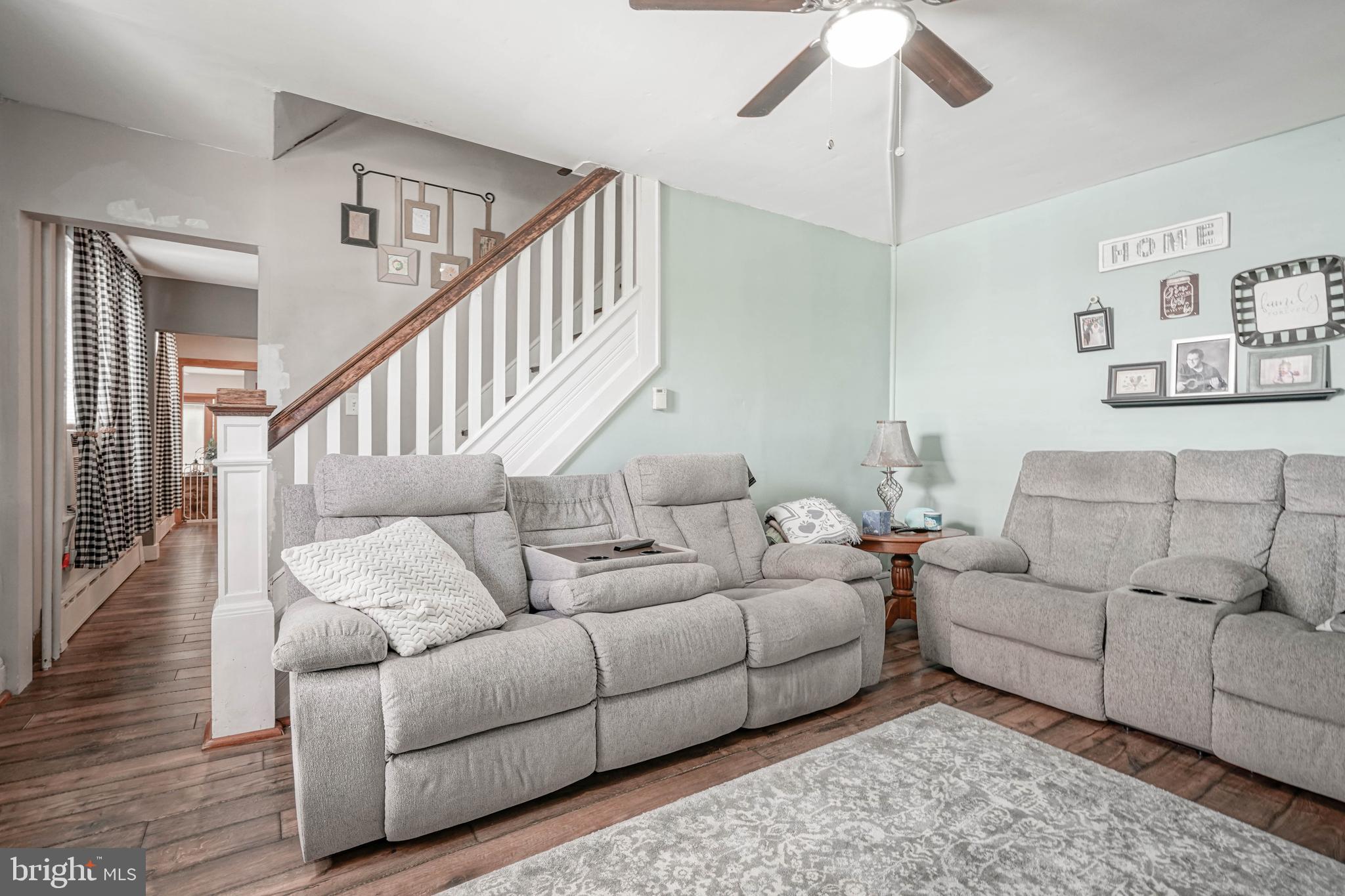 218 Walnut Street Audubon, NJ 08106 - Photo 13 of 40 a living room with furniture and a chandelier