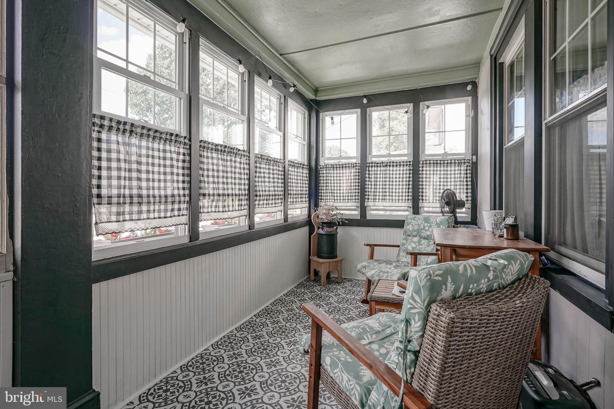 218 Walnut Street Audubon, NJ 08106 - Photo 16 of 40 a living room filled with furniture and a floor to ceiling window