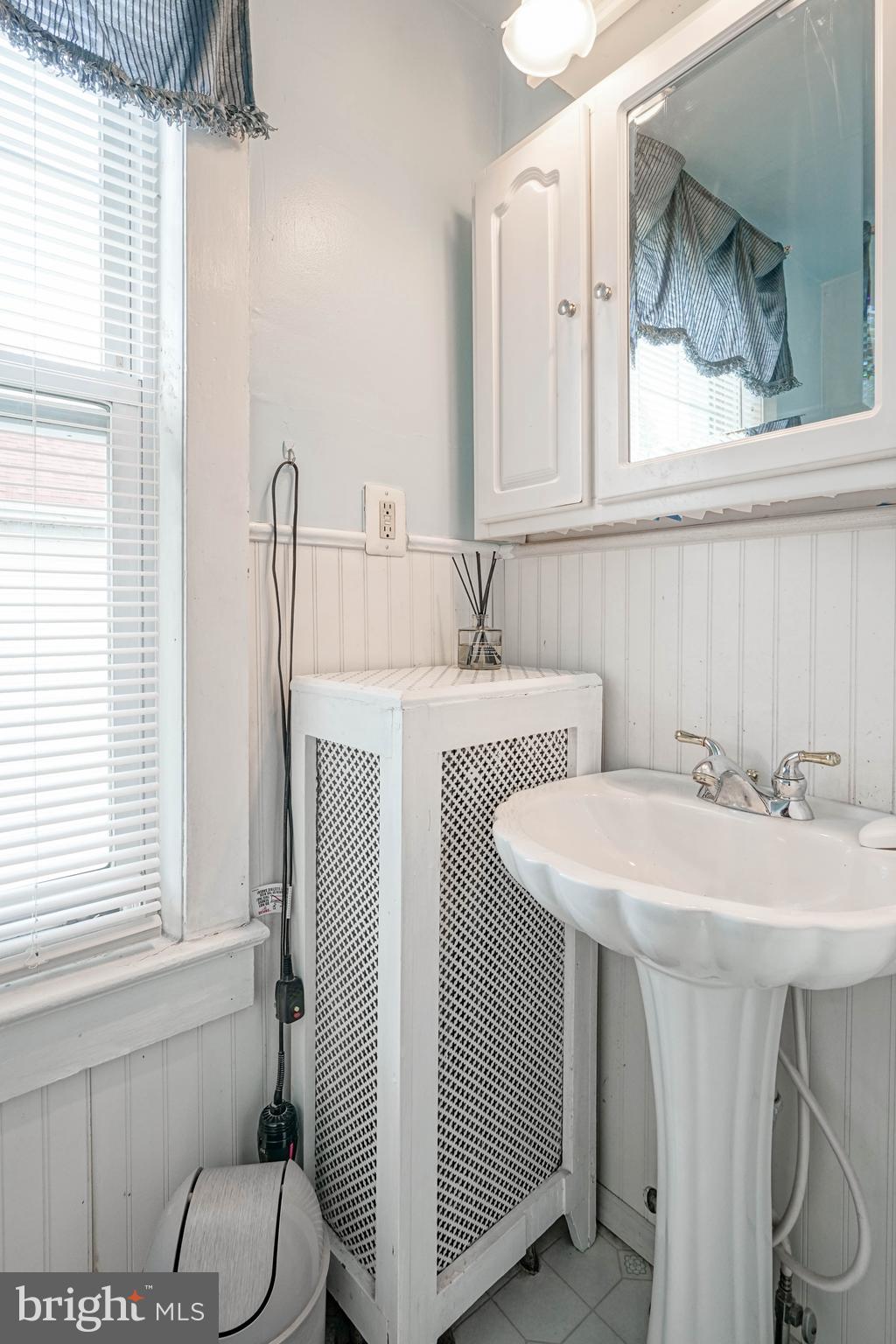 218 Walnut Street Audubon, NJ 08106 - Photo 21 of 40 a bathroom with a sink and a mirror