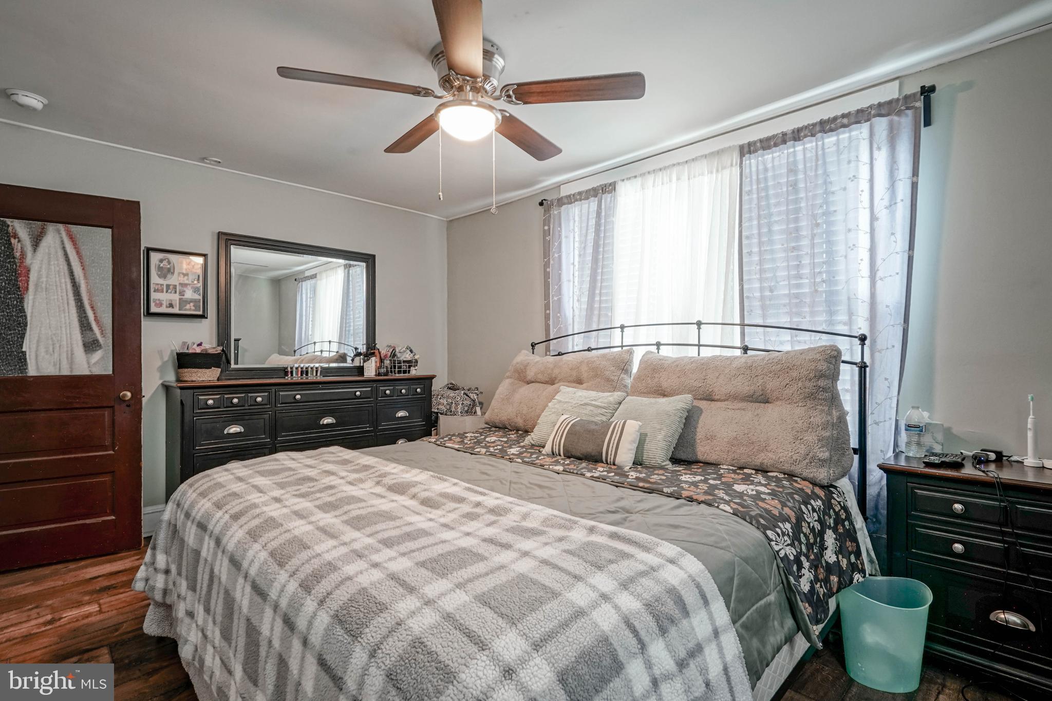 218 Walnut Street Audubon, NJ 08106 - Photo 24 of 40 a bedroom with a bed and wooden floor