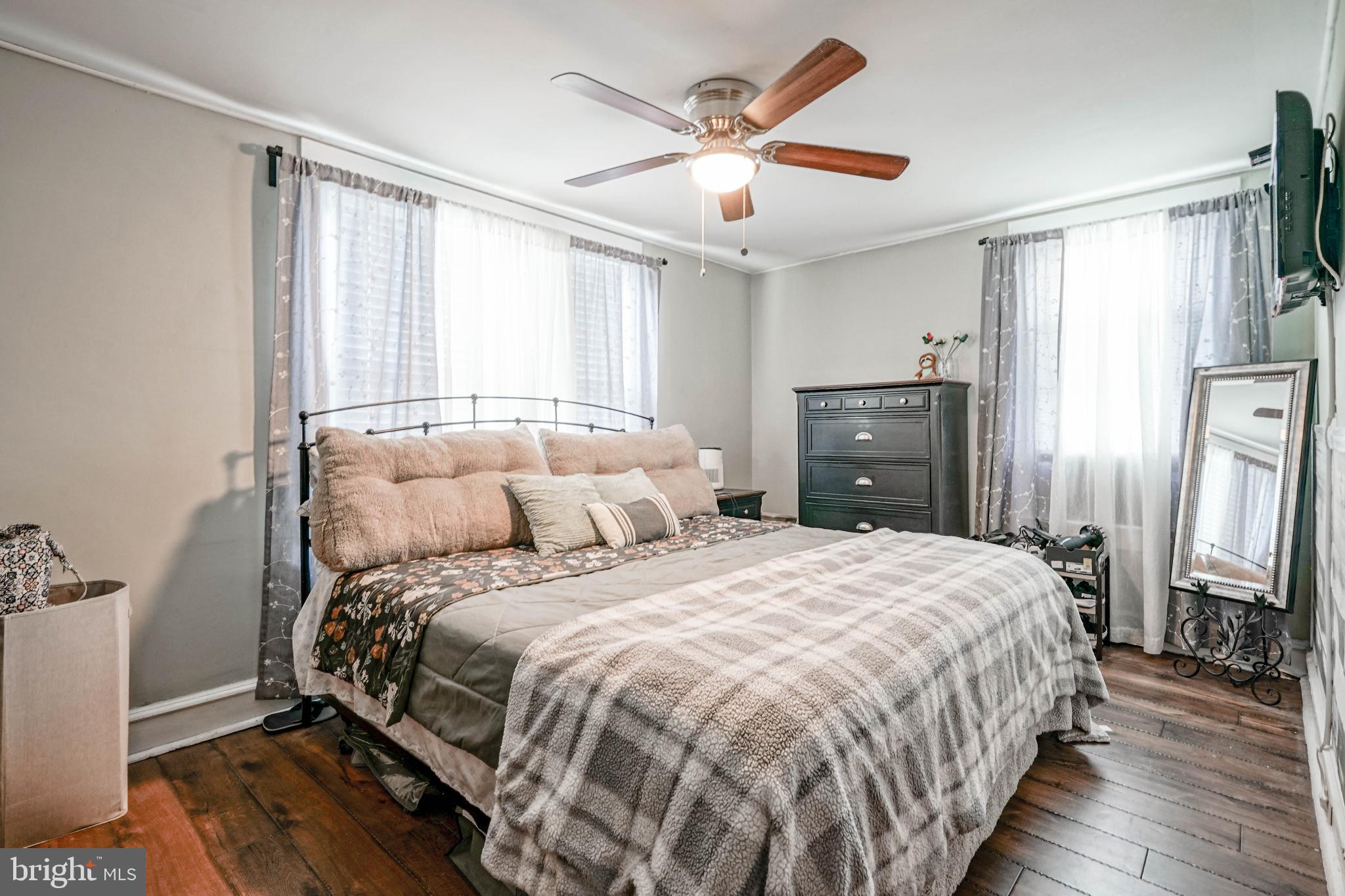 218 Walnut Street Audubon, NJ 08106 - Photo 25 of 40 a bedroom with a bed and a chandelier