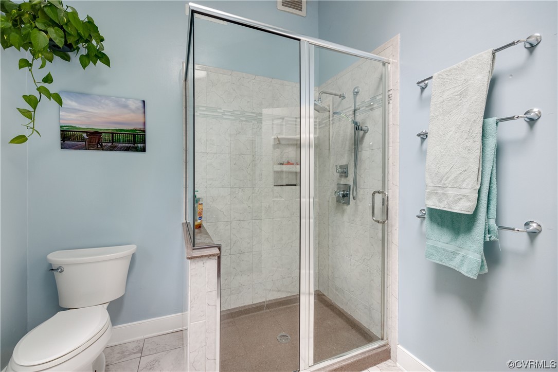 1424 Shirlton Road Midlothian, VA 23114 - Photo 24 of 42 a bathroom with a toilet sink and shower
