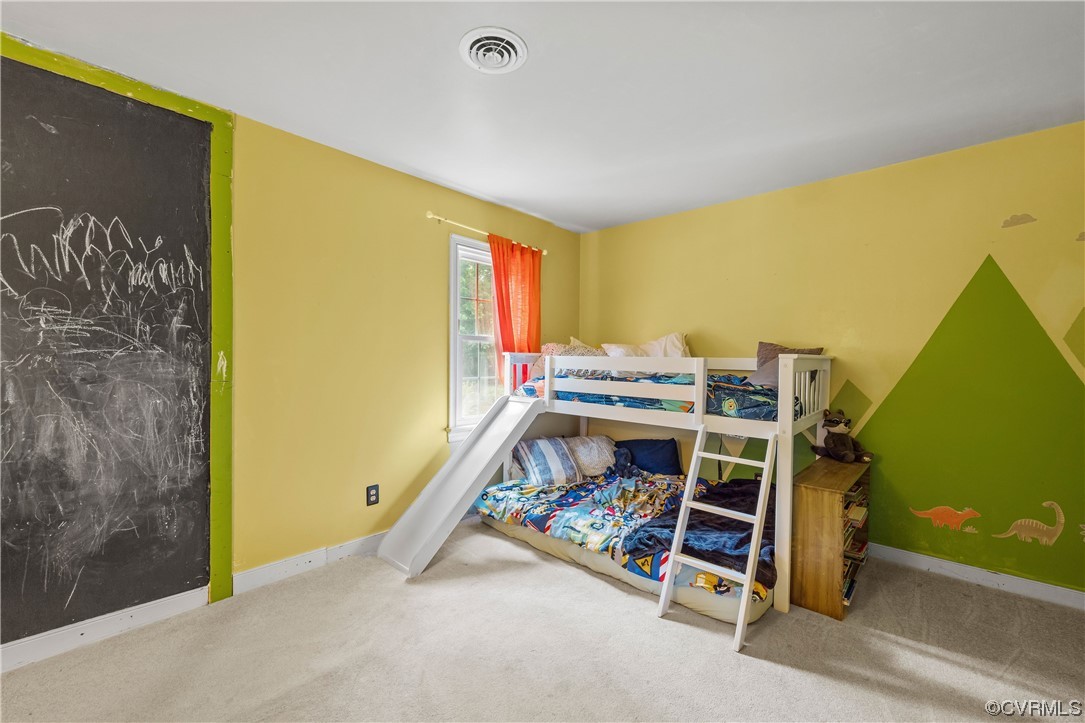 1424 Shirlton Road Midlothian, VA 23114 - Photo 26 of 42 a bedroom with a bed and a desk