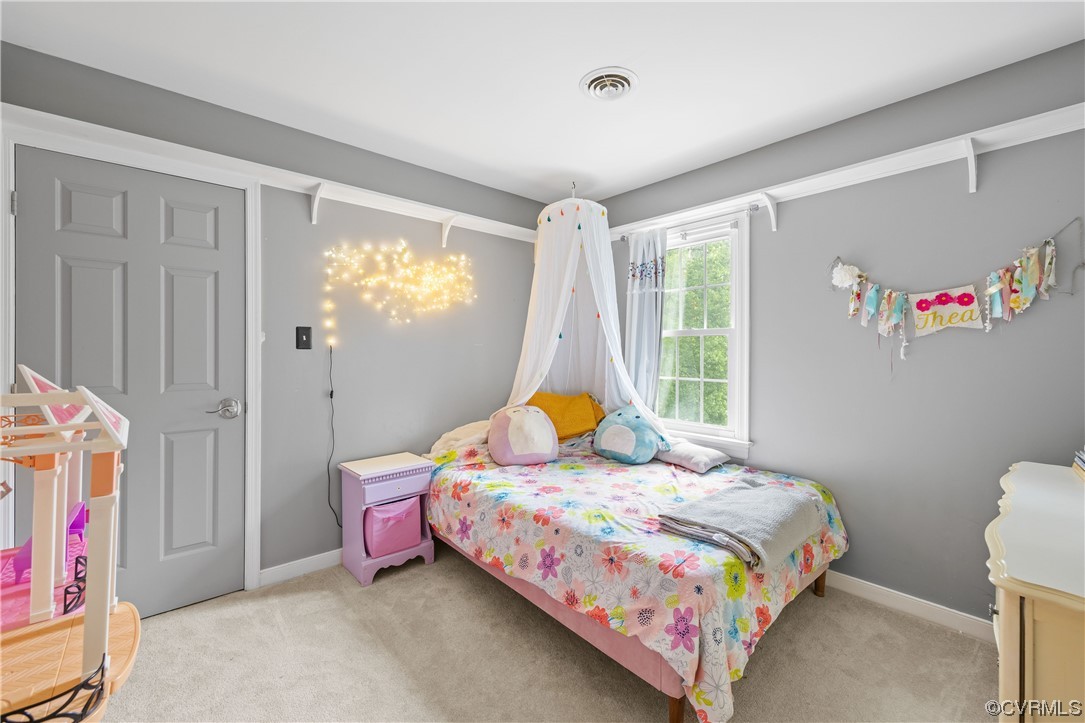 1424 Shirlton Road Midlothian, VA 23114 - Photo 27 of 42 a bedroom with a bed and a window