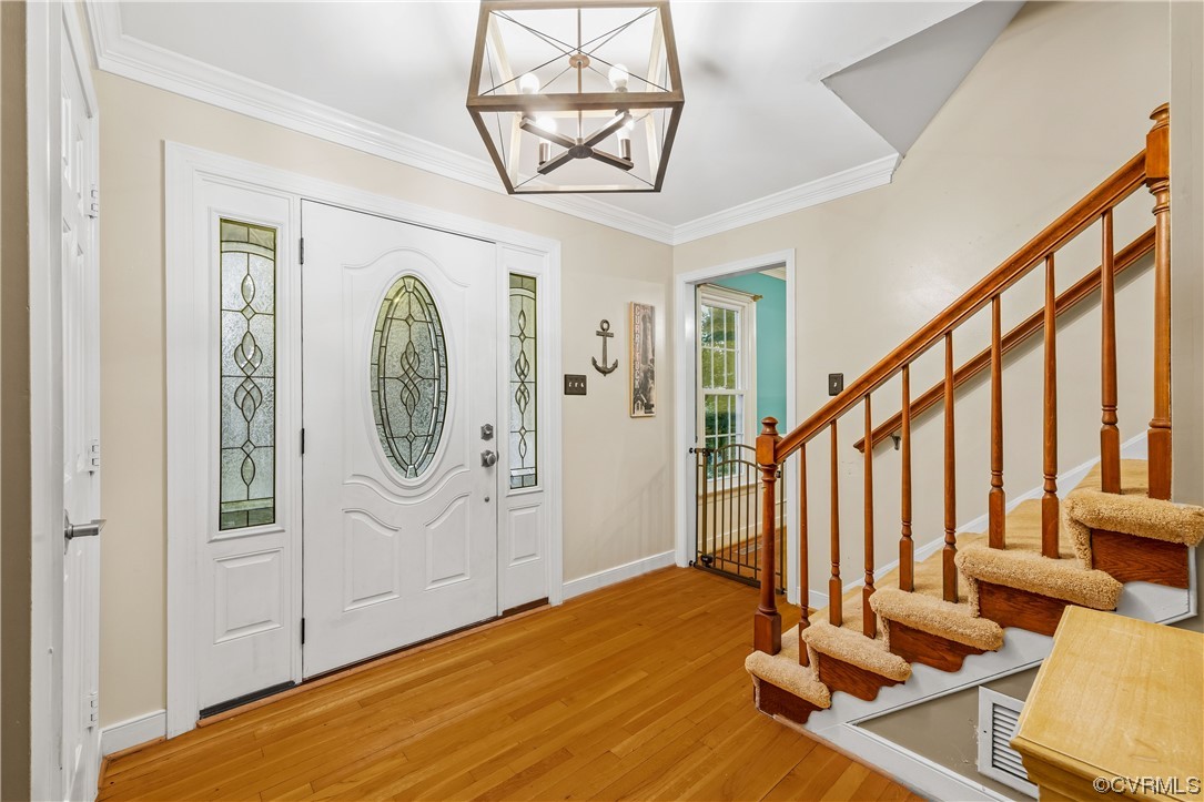 1424 Shirlton Road Midlothian, VA 23114 - Photo 6 of 42 a view of an entryway with wooden floor and door