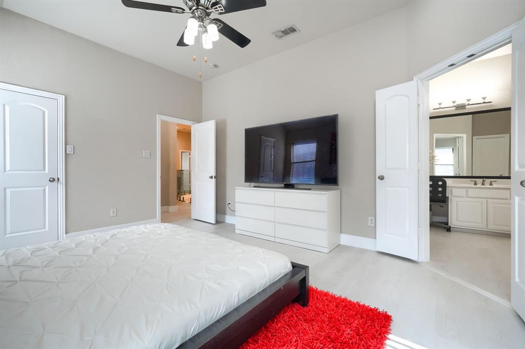 2246 Longview Road Irving, TX 75063 - Photo 30 of 40 Spacious room with vaulted ceilings and light-colored walls