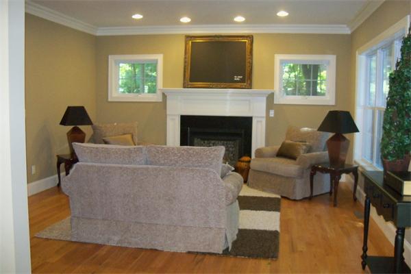 73 Fuller Brook Road Wellesley, MA 02482 - Photo 8 of 17 a living room with furniture and a fireplace
