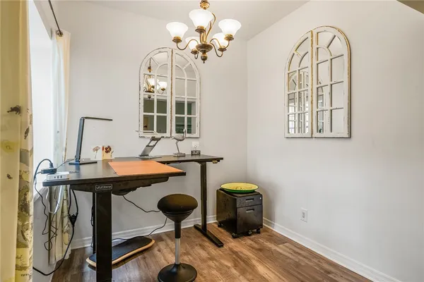 a view of hall way with furniture