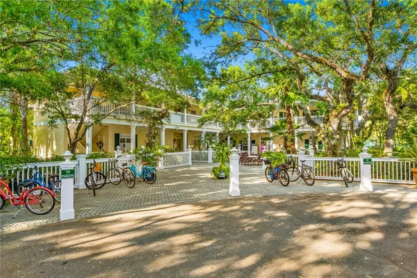 a view of a brick house with a patio