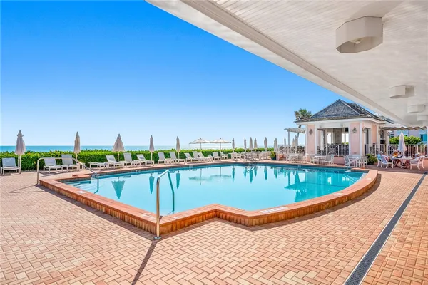 a view of a swimming pool with a balcony