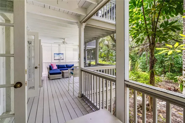 a view of a balcony with furniture