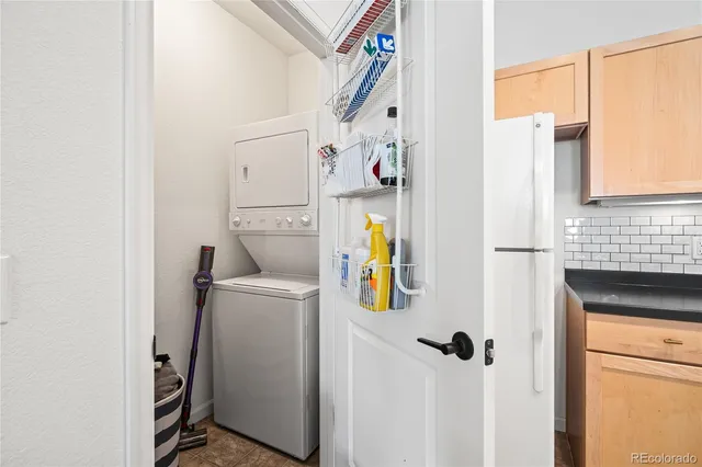 a bathroom with a refrigerator and a sink