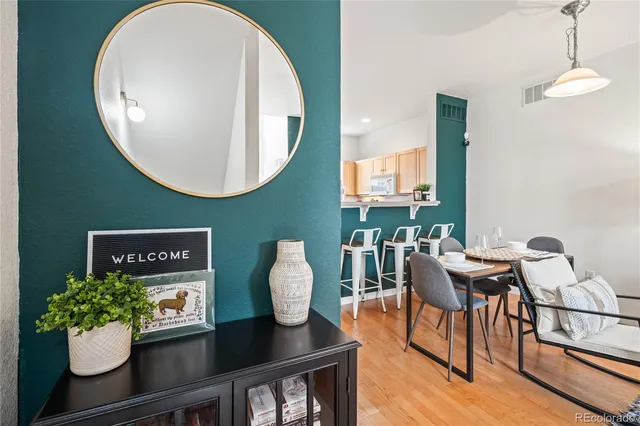 a view of a dining room with furniture and wooden floor