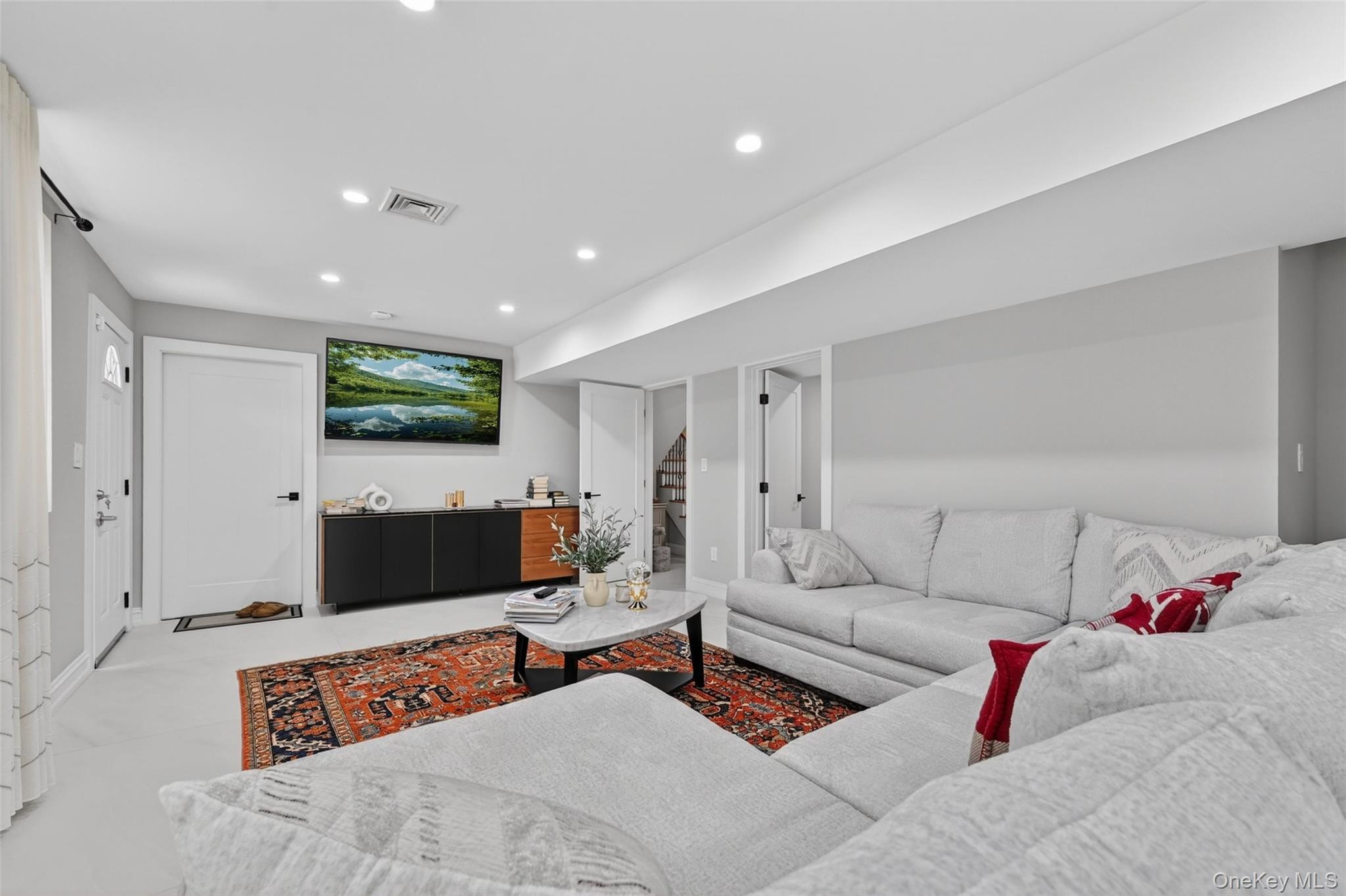 65 Wildway Bronxville, NY 10708 - Photo 25 of 42 Spacious living area featuring light-colored flooring, recessed lighting, and crisp white trim