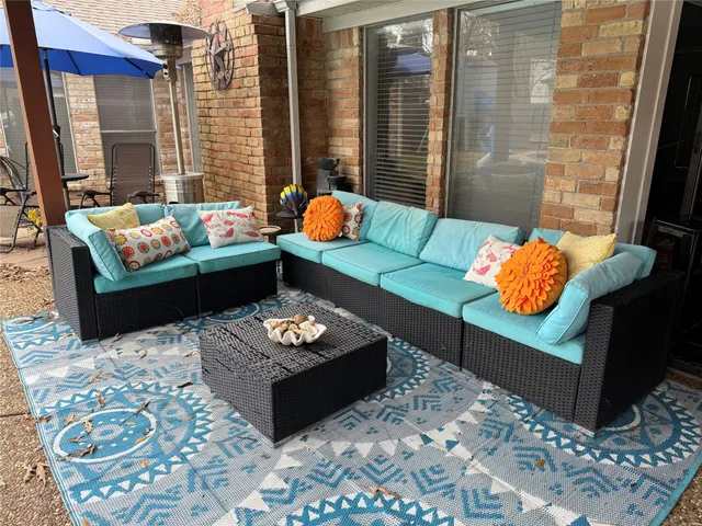 a living room with furniture and a rug