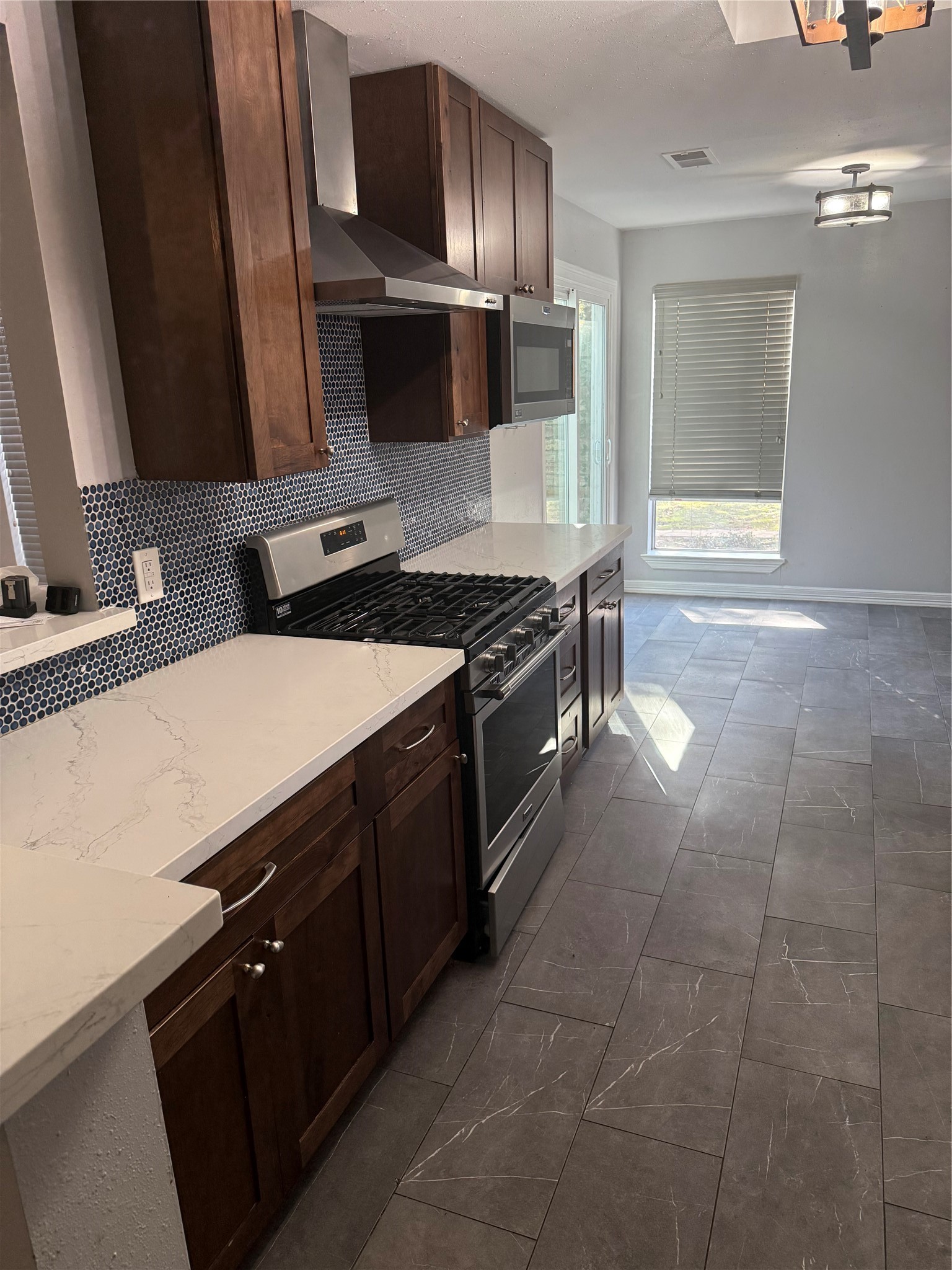 4642 Deer Point Drive Spring, TX 77389 - Photo 7 of 13 This kitchen is lovely, and even has a glass sliding door that enters into a front seating area.