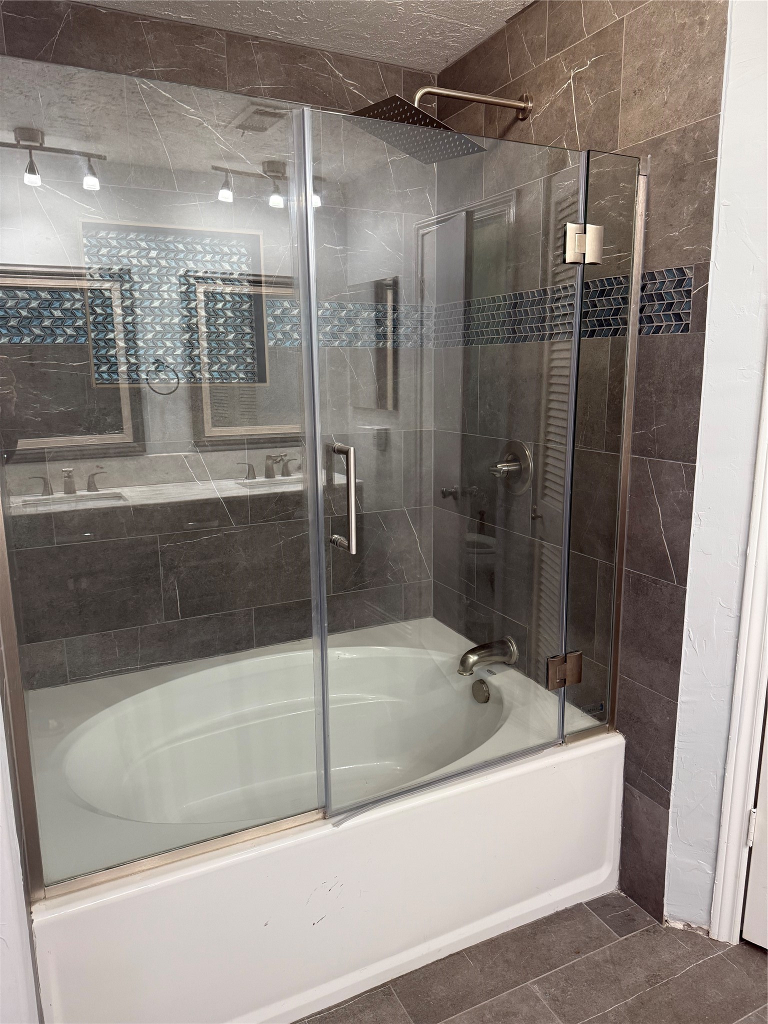 4642 Deer Point Drive Spring, TX 77389 - Photo 10 of 13 Primary bathroom includes shower/tub combo and double sinks with beautiful slate flooring.