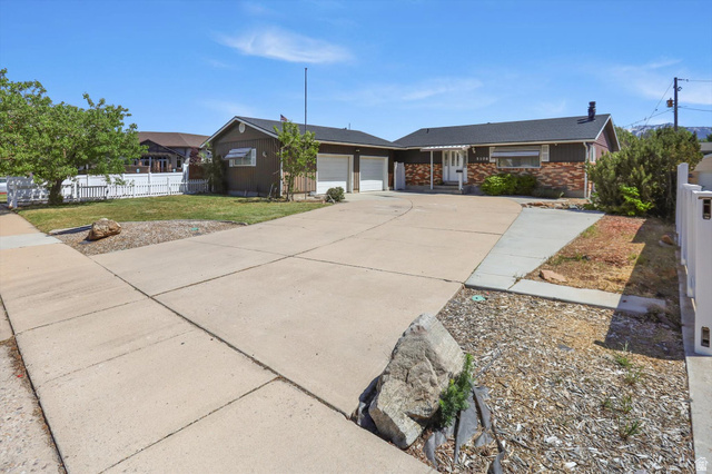 5108 South 2000th Street West Roy, UT 84067 - Photo 1 of 61 Single story home featuring an attached garage, concrete driveway, and brick siding with RV parking