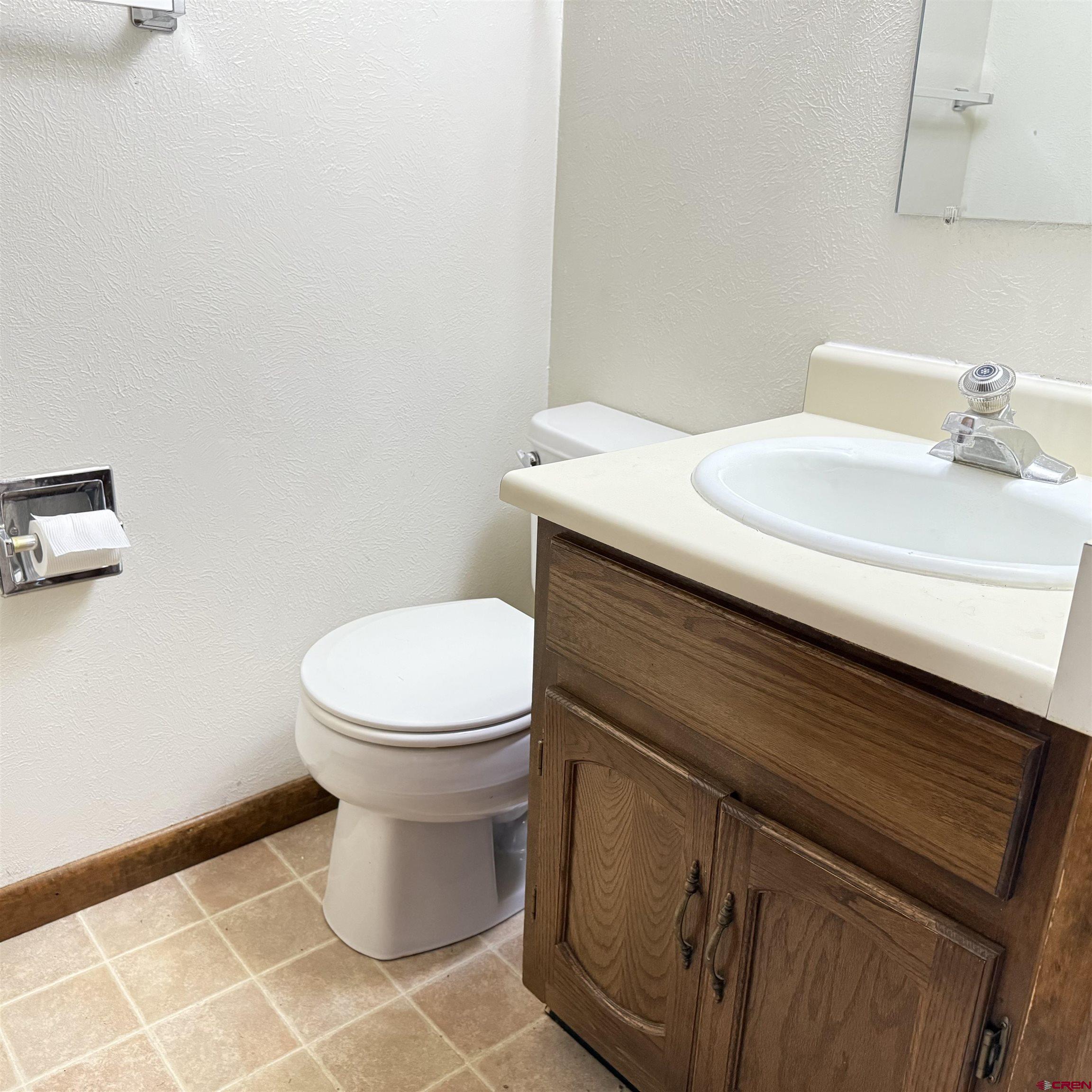 1021 West Denver Avenue, Unit 4 Gunnison, CO 81230 - Photo 19 of 26 a bathroom with a toilet and a sink