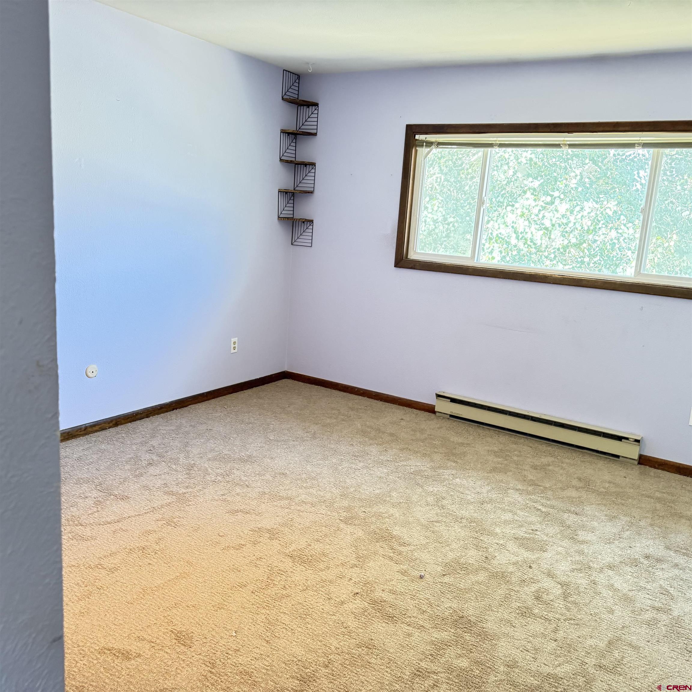 1021 West Denver Avenue, Unit 4 Gunnison, CO 81230 - Photo 20 of 26 a view of an empty room with a window