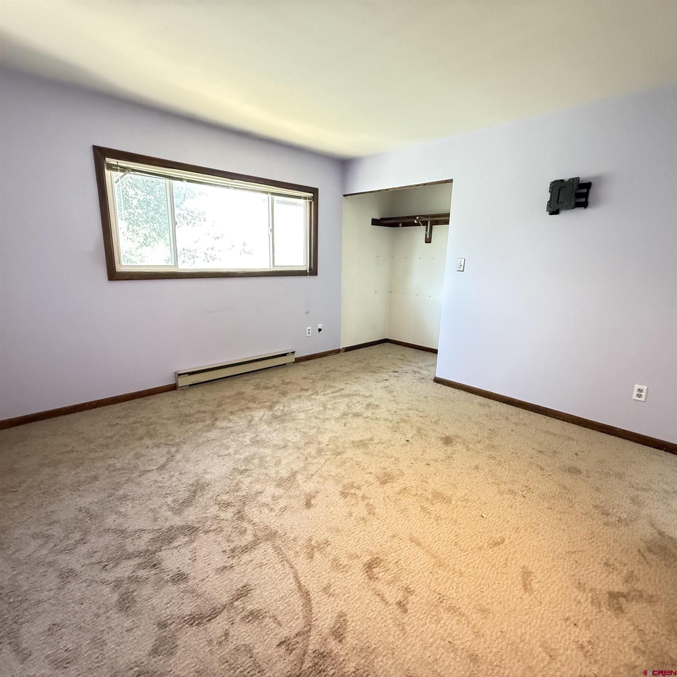 1021 West Denver Avenue, Unit 4 Gunnison, CO 81230 - Photo 22 of 26 an empty room with windows