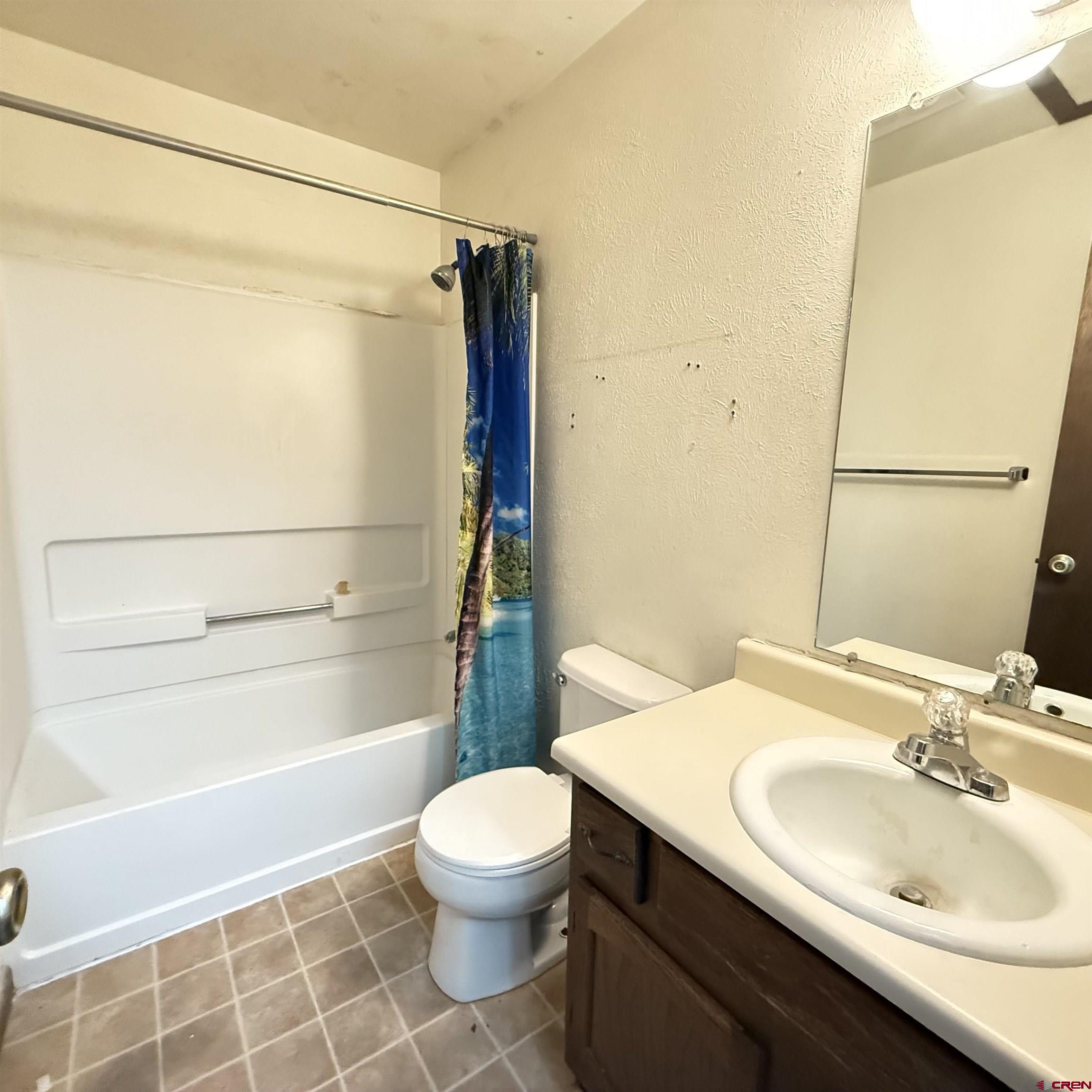 1021 West Denver Avenue, Unit 4 Gunnison, CO 81230 - Photo 23 of 26 a bathroom with a sink toilet and shower