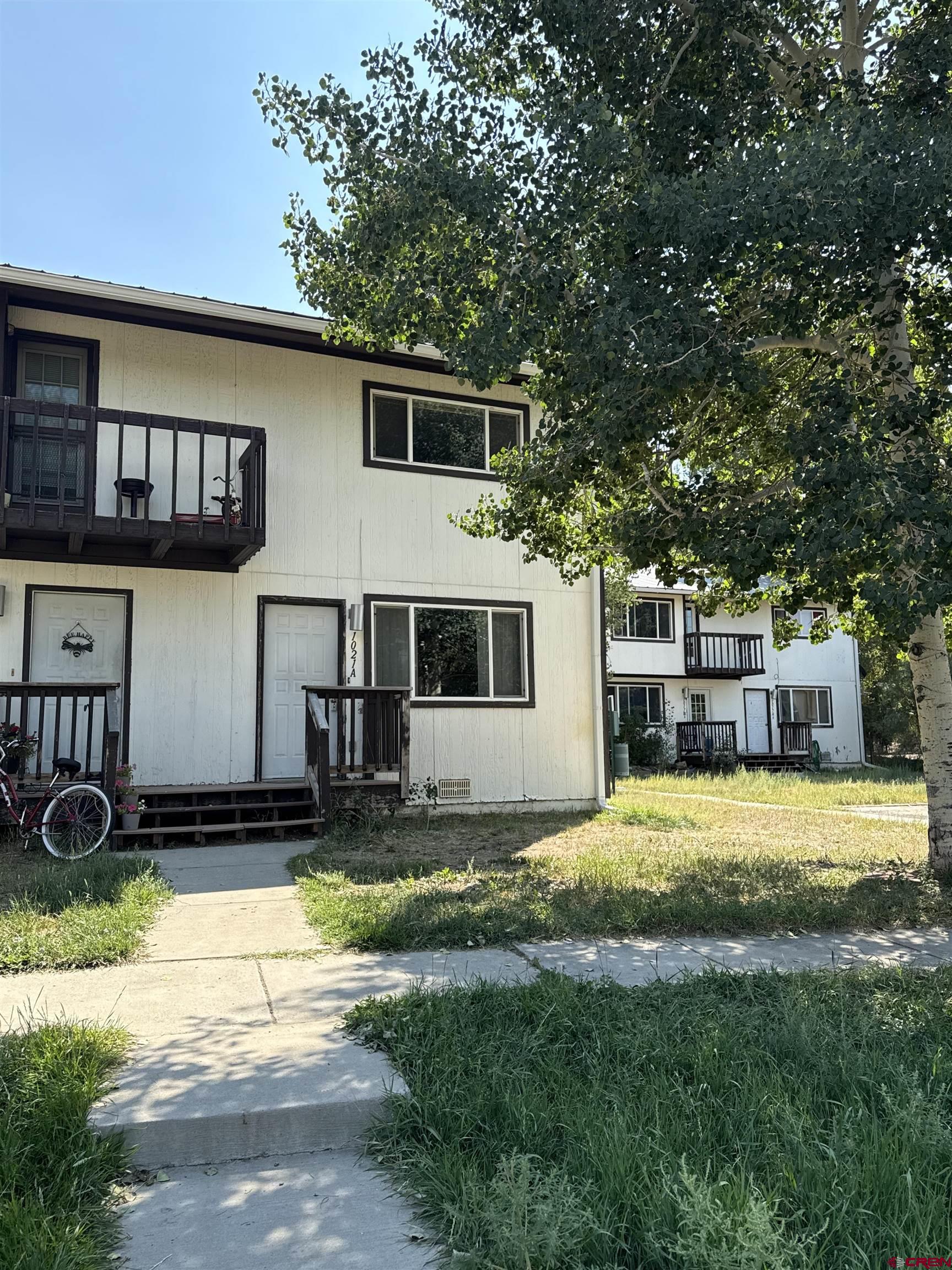 1021 West Denver Avenue, Unit 4 Gunnison, CO 81230 - Photo 3 of 26 a view of a house with backyard and sitting area