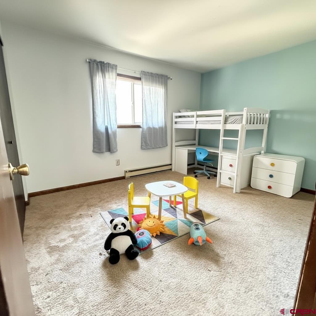 1021 West Denver Avenue, Unit 4 Gunnison, CO 81230 - Photo 6 of 26 a play room with furniture