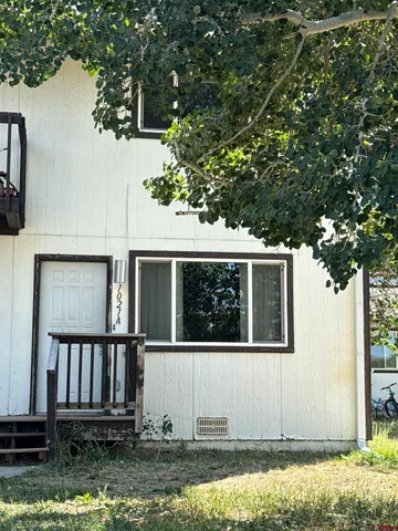 a house with trees in the background