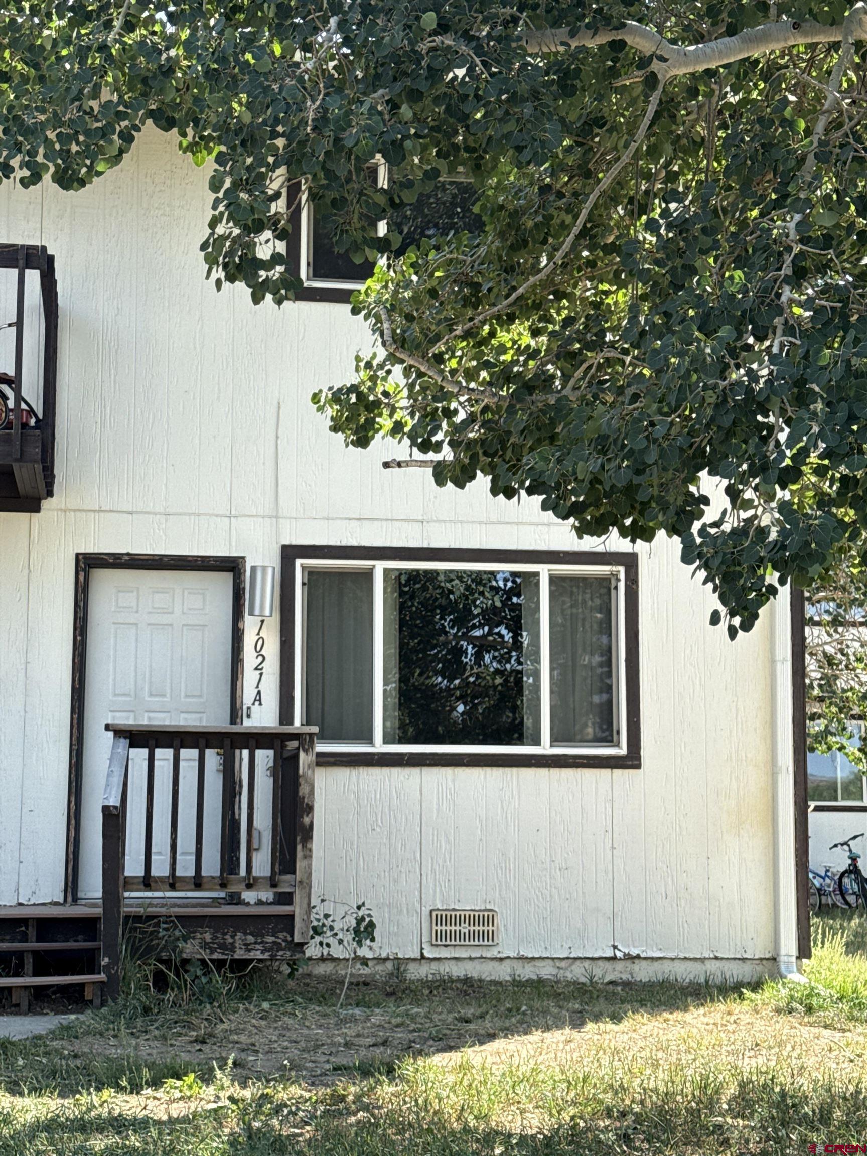 1021 West Denver Avenue, Unit 4 Gunnison, CO 81230 - Photo 7 of 26 a house with trees in the background