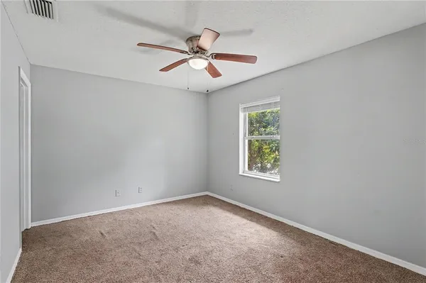 a kitchen with stainless steel appliances granite countertop white cabinets granite counter tops and a hard wood floors