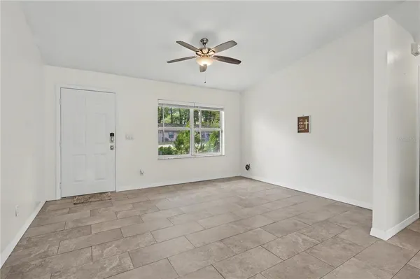 a view of an empty room with a window